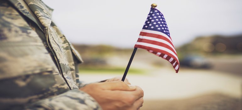 American military soldier holding a flag
