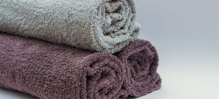 Three rolled-up towels