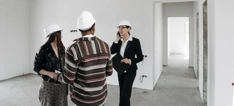 People talking with their agent about the best DMV cities for real estate investment