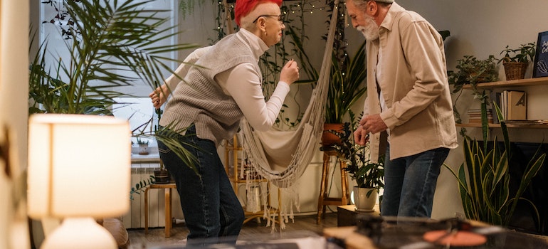 An elderly couple dancing together 