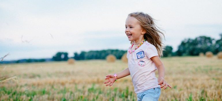 a child smiling while running