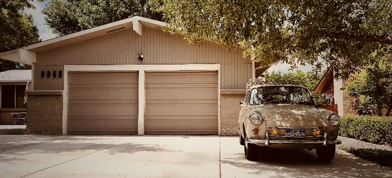 car parked in front of a garage