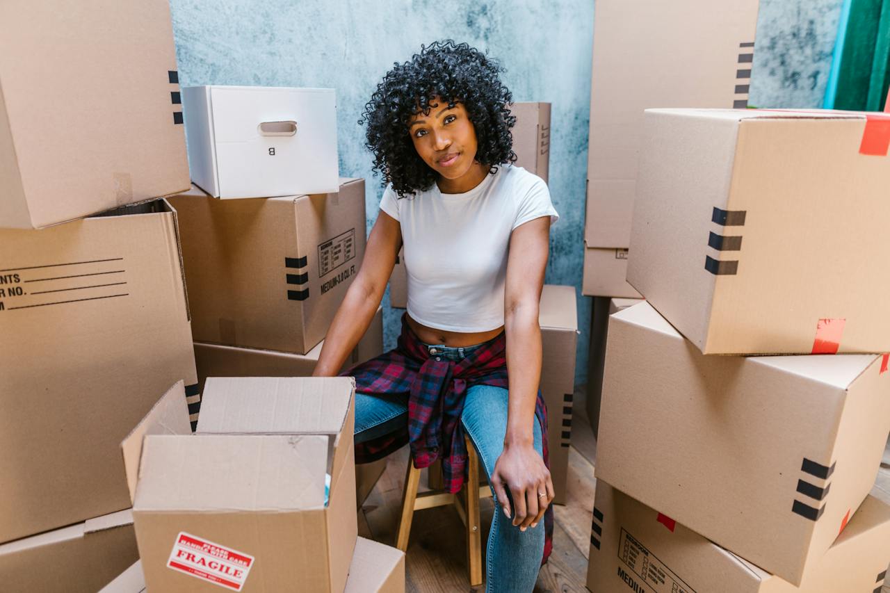 a woman surrounded by boxes